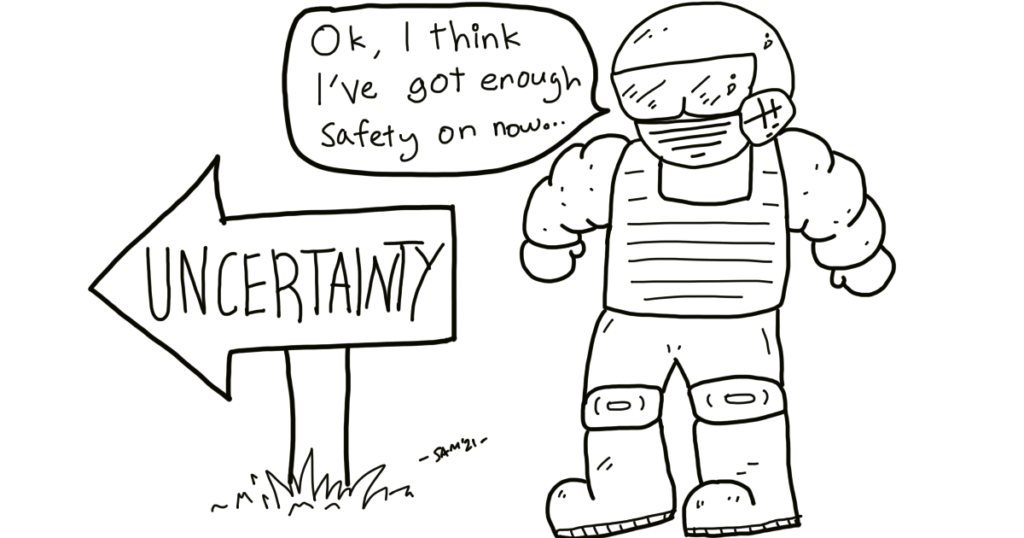A man wearing a safety suit looks at a sign titled, "uncertainty" and says, "Okay, I think I've got enough safety on now."